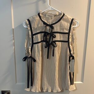 Cream Sleeveless Top with Black Bows